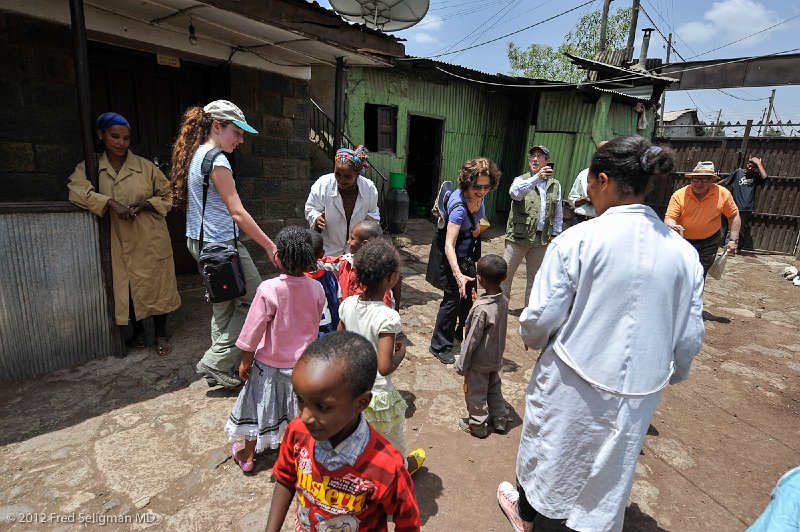 20120328_113749 Nikon D3 2x3.jpg - Members of the US ESRI delegation interacting with the children.